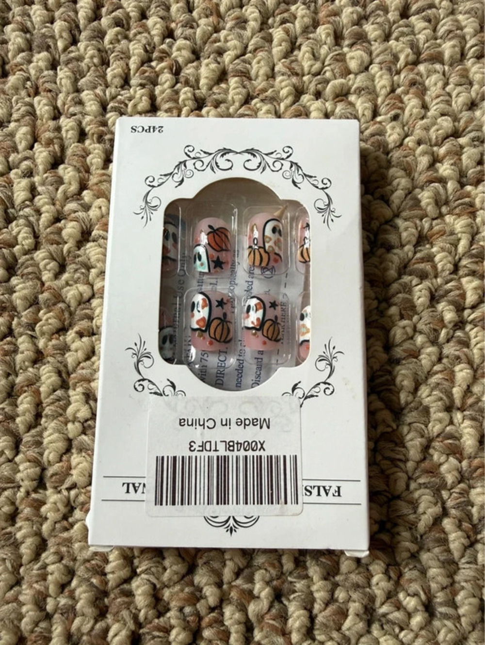 Pink Halloween press on nails with pumpkins and ghosts design